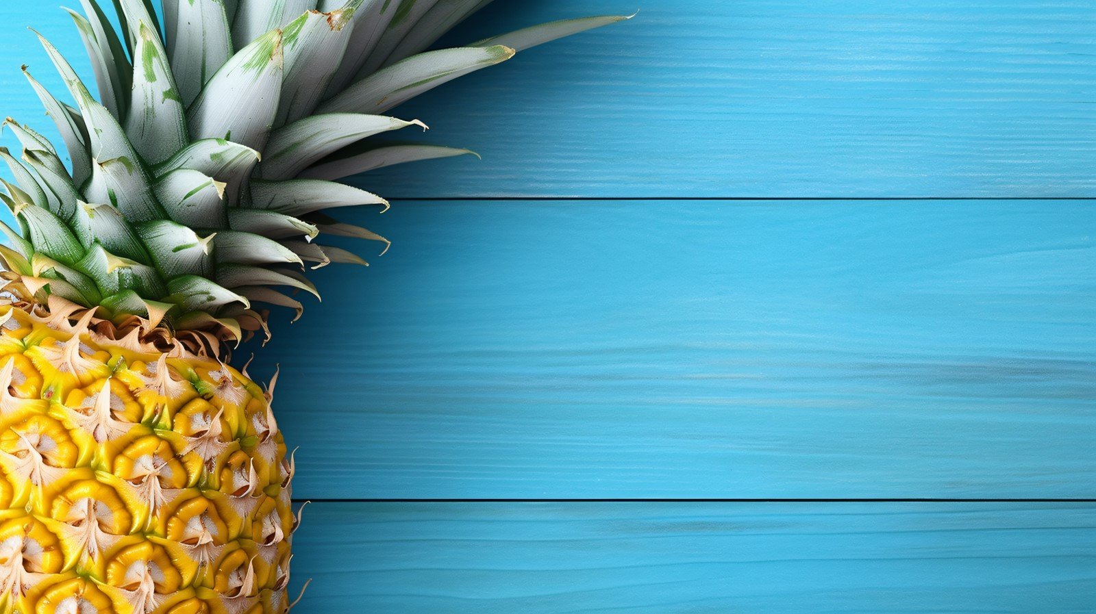 Pineapple on light blue wooden background 005